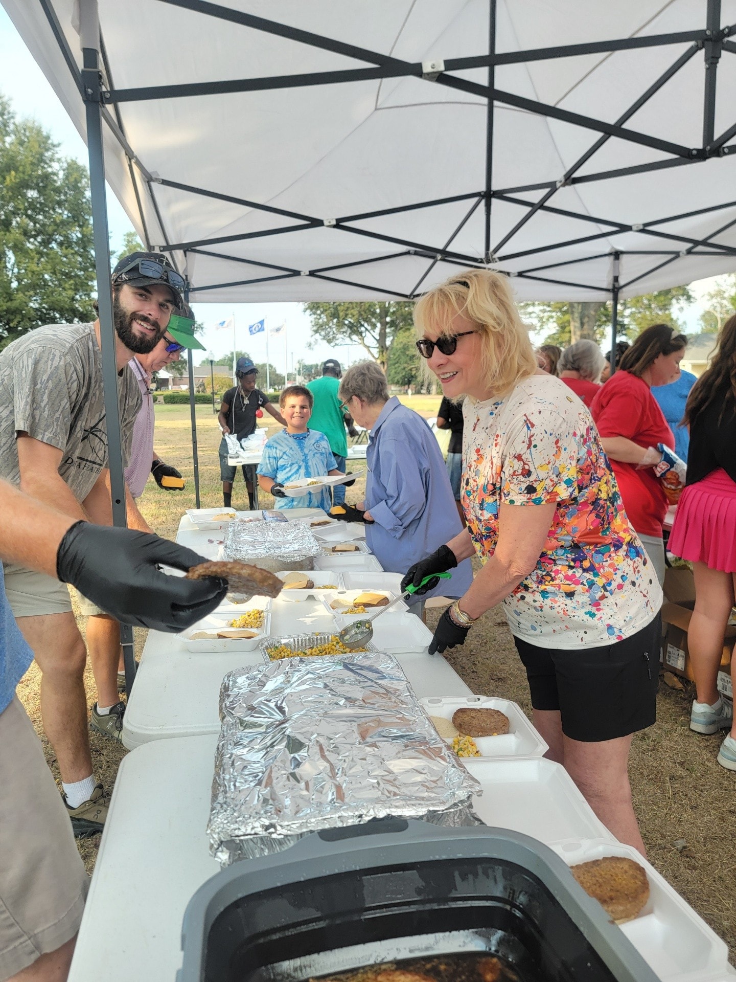 Volunteers serving meals to the community